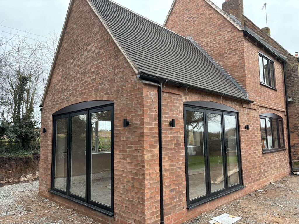 Black-Bi-Fold-Doors-installed-by-Eco-Windows-in-Kenilworth