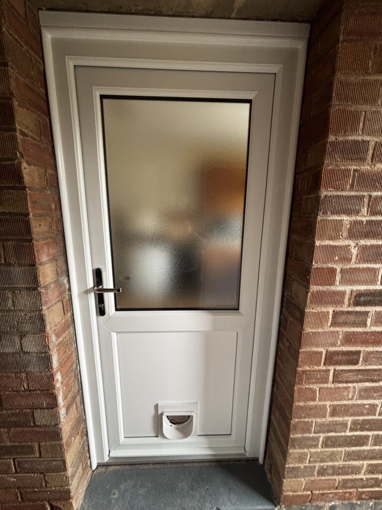 White-uPVC-Door-with-cat-flap-installed-by-Eco-Windows-in-Hinckley