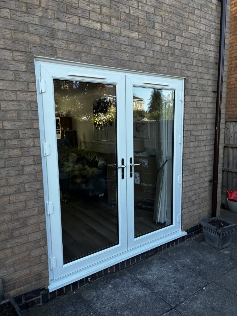 White-uPVC-french-door-installed-in-St-Nicholas-Park-by-Eco-Windows